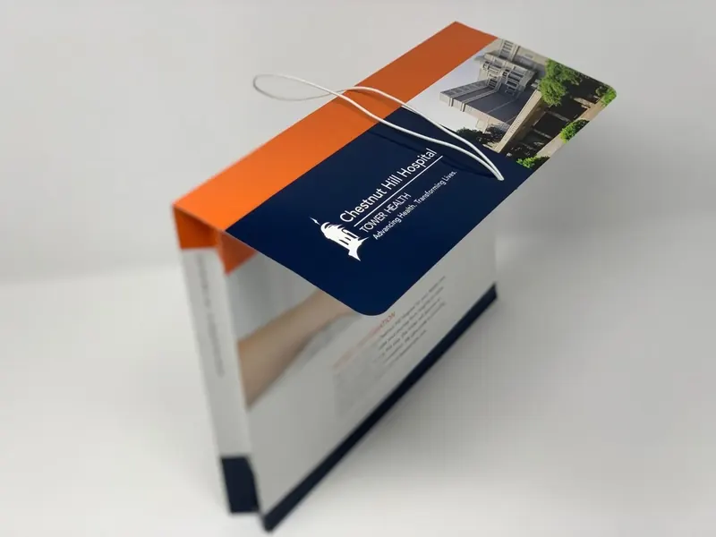 Chestnut Hill Hospital folder seen from above at an angle, cover and elastic closure visible