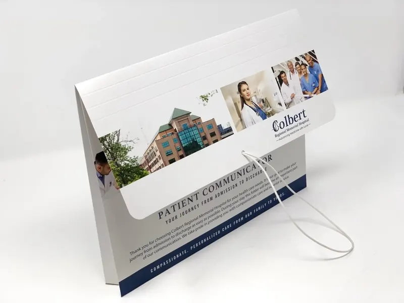 Colbert Regional Memorial Hospital Patient Communicator folder standing closed with its elastic loop closure