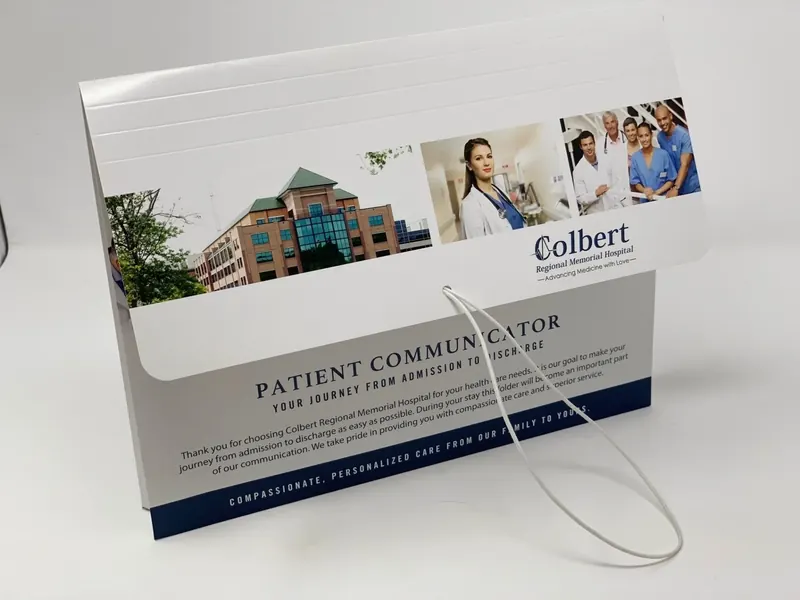 Colbert Regional Memorial Hospital folder, closed, printed with the hospital exterior and a band of care photography