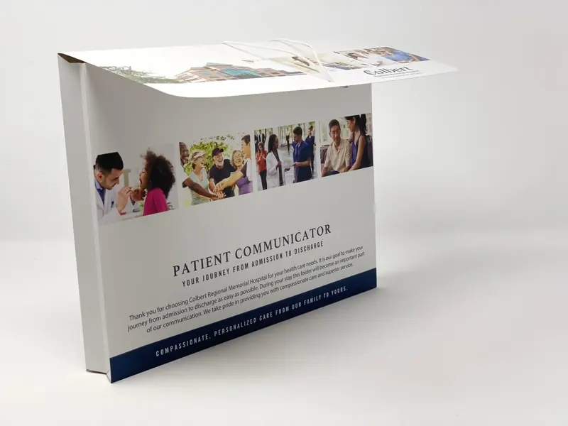 Colbert Regional Memorial Hospital folder standing upright, cover message and photo band visible