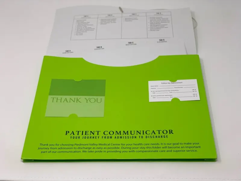 Piedmont Valley Medical Center folder open, showing a thank-you card pocket, an appointment card and a tabbed index