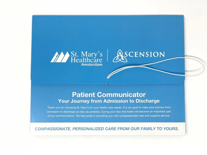 St. Mary&rsquo;s Healthcare Amsterdam Patient Communicator folder, closed, with an elastic loop closure